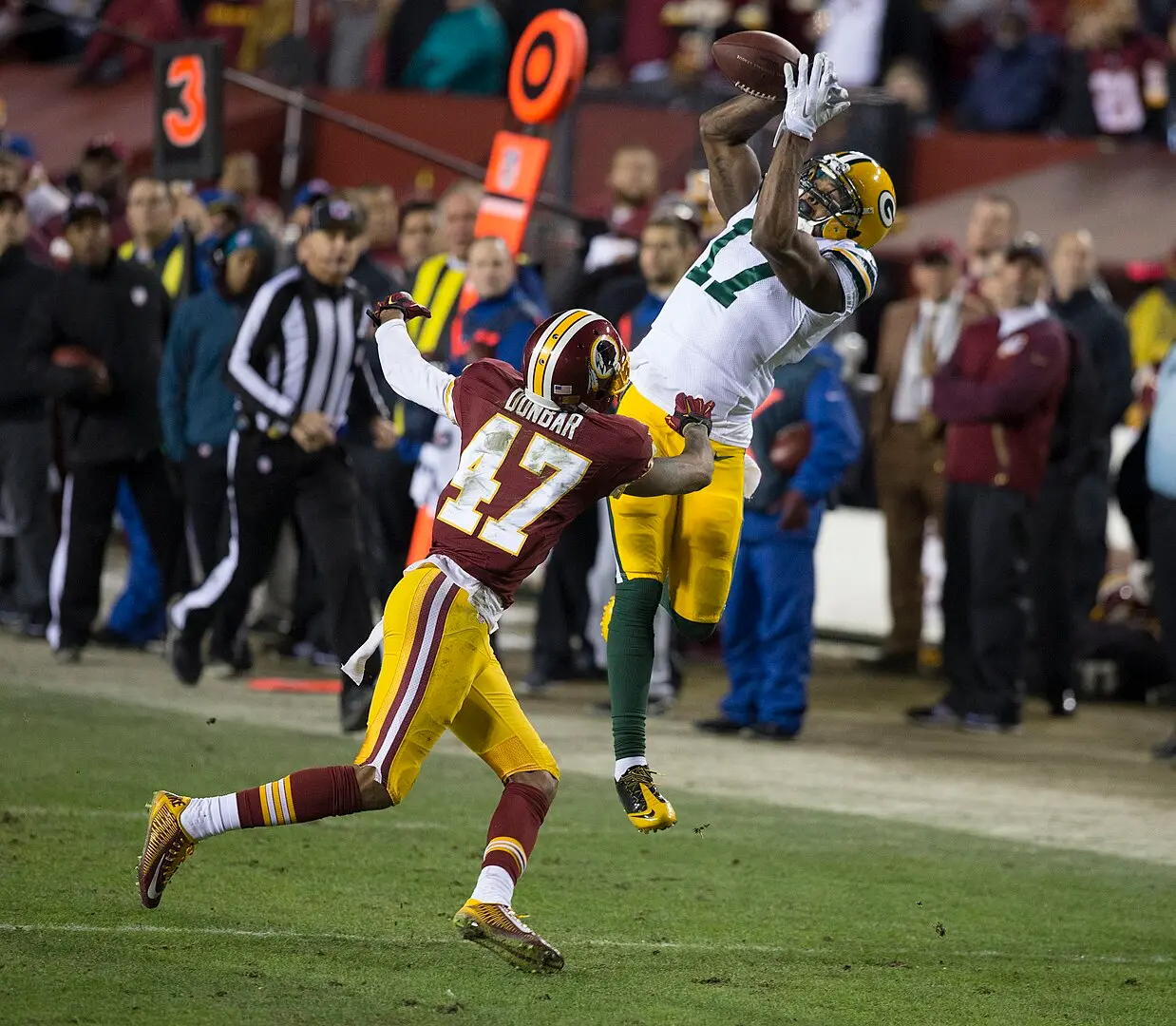 Adams catching a pass over Washington Redskins cornerback Quinton Dunbar during the Packers-Redskins playoff game in 2016